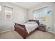 Bedroom with a cozy bed, natural light, and aviation themed decor at 5425 E 125Th Pl, Thornton, CO 80241
