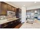 Elegant kitchen with granite countertops, stainless steel appliances, and a gas cooktop on the island at 5425 E 125Th Pl, Thornton, CO 80241