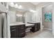 Main bathroom featuring double vanity, granite countertops, and tiled flooring at 5425 E 125Th Pl, Thornton, CO 80241