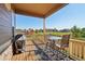 Covered patio featuring outdoor seating and a barbecue grill with views of a playground and green space at 5425 E 125Th Pl, Thornton, CO 80241