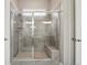 Large tiled shower with a built-in bench seat at 5425 E 125Th Pl, Thornton, CO 80241