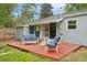This cozy backyard deck with seating is perfect for enjoying the outdoors at 5445 Nebraska Way, Denver, CO 80246