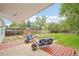 Outdoor patio with seating, lush greenery, and plenty of room for outdoor entertaining at 5445 Nebraska Way, Denver, CO 80246