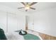 Bright and airy bedroom with hardwood floors and a view of the closet and bathroom at 5445 Nebraska Way, Denver, CO 80246