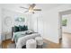 Charming bedroom with hardwood floors, fresh paint, new windows, closet, and natural light at 5445 Nebraska Way, Denver, CO 80246