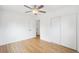 Spacious bedroom with hardwood floors, natural light, and large closet space at 5445 Nebraska Way, Denver, CO 80246