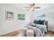 Cozy bedroom featuring hardwood floors, neutral paint, and two windows that let in natural light at 5445 Nebraska Way, Denver, CO 80246