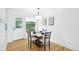 Cozy dining room featuring a modern table and chairs, creating a comfortable space for meals and gatherings at 5445 Nebraska Way, Denver, CO 80246