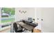 Well-lit home office featuring a modern desk, ample natural light, and a clean, minimalist aesthetic at 5445 Nebraska Way, Denver, CO 80246