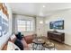 Cozy living room showcasing a comfortable sofa, contemporary decor, and a bright, airy atmosphere at 9855 Biscay St, Commerce City, CO 80022