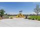 Community playground featuring slides and benches with surrounding trees and grass at 9855 Biscay St, Commerce City, CO 80022