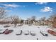 Aerial view of the community with snowy landscape at 14191 E Jewell Ave # 203, Aurora, CO 80012