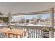 Private balcony with table and chairs, overlooking community at 14191 E Jewell Ave # 203, Aurora, CO 80012