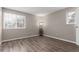 Bright bedroom with wood-look floors and neutral walls at 14191 E Jewell Ave # 203, Aurora, CO 80012