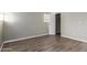 Simple bedroom with wood-look floors and neutral walls at 14191 E Jewell Ave # 203, Aurora, CO 80012
