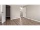 Simple bedroom with wood-look floors and neutral walls at 14191 E Jewell Ave # 203, Aurora, CO 80012