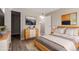 Spacious bedroom with wood-look floors and neutral walls at 14191 E Jewell Ave # 203, Aurora, CO 80012