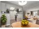 Bright dining area with wood-look floors and updated kitchen at 14191 E Jewell Ave # 203, Aurora, CO 80012