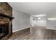 Living room with hardwood floors and stone fireplace at 14191 E Jewell Ave # 203, Aurora, CO 80012