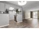 Open living room and kitchen with updated floors at 14191 E Jewell Ave # 203, Aurora, CO 80012