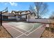 Spacious backyard with a basketball court and volleyball net, great for outdoor activities at 2960 High Prairie Way, Broomfield, CO 80023