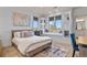 Bright bedroom with lots of natural light, plush pillows, and built-in shelving at 2960 High Prairie Way, Broomfield, CO 80023