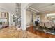 Elegant dining room featuring a modern chandelier and arched doorways at 2960 High Prairie Way, Broomfield, CO 80023