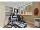 Home gym with large windows and multiple fitness machines at 2960 High Prairie Way, Broomfield, CO 80023