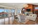 Bright living room featuring hardwood floors, fireplace, and access to an outdoor patio at 2960 High Prairie Way, Broomfield, CO 80023
