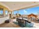 Spacious outdoor patio offering covered dining with picturesque views and wrought iron railings at 2960 High Prairie Way, Broomfield, CO 80023
