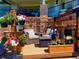 Charming patio adorned with colorful hanging flower baskets, creating a cozy outdoor retreat at 2960 High Prairie Way, Broomfield, CO 80023