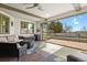 Covered patio with seating area overlooking the outdoor pool and landscape at 2960 High Prairie Way, Broomfield, CO 80023