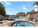 Inviting pool and hot tub area with a pergola and ample space for outdoor enjoyment at 2960 High Prairie Way, Broomfield, CO 80023