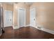 Spacious bedroom with ample closet space, wood look floors, and neutral paint, offering comfort and functionality at 458 Cherry St, Hudson, CO 80642