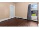 Cozy bedroom with wood-look floors, natural light, neutral paint, and simple trim at 458 Cherry St, Hudson, CO 80642
