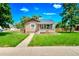 Charming single-story home with a well-manicured lawn, sidewalk and traditional architectural details at 458 Cherry St, Hudson, CO 80642