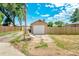 Detached garage with white door, offering convenient parking and storage options at 458 Cherry St, Hudson, CO 80642