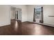 Bright living room with ample natural light, hardwood floors, neutral paint and classic trim at 458 Cherry St, Hudson, CO 80642