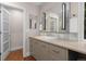 Bathroom vanity with updated sink, large mirror, and modern lighting at 6625 E 6Th Avenue Pkwy, Denver, CO 80220