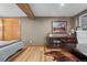 Comfortable bedroom with hardwood floors, a full size bed, and a wooden storage console at 6625 E 6Th Avenue Pkwy, Denver, CO 80220