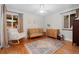 Bright Bedroom with natural light, light wood floors, neutral decor, and rocking chair at 6625 E 6Th Avenue Pkwy, Denver, CO 80220