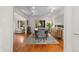 Bright dining space with hardwood floors, contemporary lighting, and seamless flow to living area at 6625 E 6Th Avenue Pkwy, Denver, CO 80220