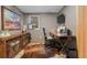 A compact home office with a rustic wooden console and an office desk at 6625 E 6Th Avenue Pkwy, Denver, CO 80220