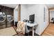 Laundry area with modern washer and dryer alongside a computer desk space at 6625 E 6Th Avenue Pkwy, Denver, CO 80220