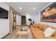 Inviting living room with modern décor, wood floors, and a comfortable leather couch at 6625 E 6Th Avenue Pkwy, Denver, CO 80220
