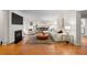 Inviting living room with a fireplace, plush seating, and an adjacent dining area at 6625 E 6Th Avenue Pkwy, Denver, CO 80220
