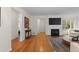 Open living room with hardwood floors, modern fireplace, and natural light at 6625 E 6Th Avenue Pkwy, Denver, CO 80220