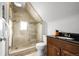 Modern bathroom features a tiled stand up shower, updated vanity, and fixtures at 3632 N Marion St, Denver, CO 80205