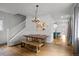 Open concept dining area with hardwood floors and view to the kitchen at 3632 N Marion St, Denver, CO 80205