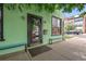 Charming storefront with a green facade, accent benches, and a welcoming entrance at 3632 N Marion St, Denver, CO 80205